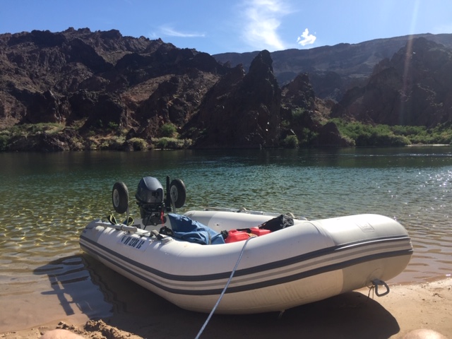 2018 Zodiac and Yamaha 15 beached on river.