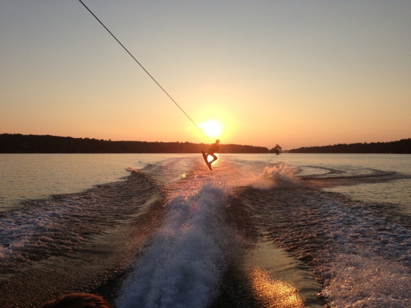 Wakeboarding at sunset